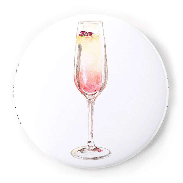 Image of a pin-back button of a grapefruit mimosa in watercolor | Original greeting cards painted in watercolor by CharmCat | charmcat.net