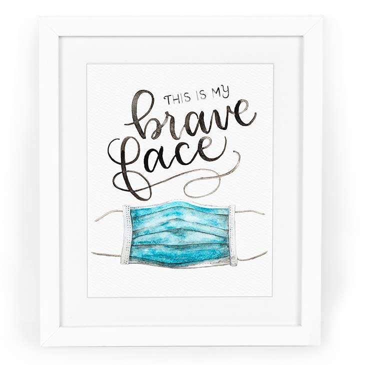 Image of a watercolor print with hand-lettering saying “This is my brave face” with a surgical mask in watercolor | Original artwork painted in watercolor by CharmCat | charmcat.net