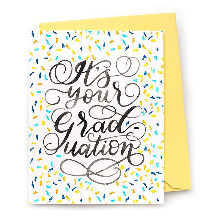 Image of a hand-lettered watercolor card saying "It's your graduation" with confetti by CharmCat | charmcat.net