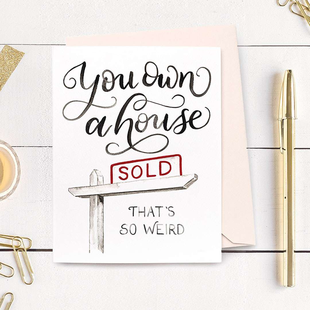 Image of a hand-lettered watercolor card saying "You own a house... that's so weird" with a sold sign by CharmCat | charmcat.net