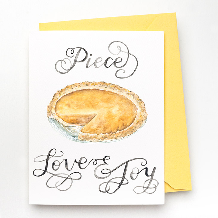 Image of a hand-lettered watercolor card saying "Piece Love & Joy" with a painted pumpkin pie by CharmCat | charmcat.net