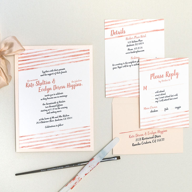 Striped wedding invitation with watercolor stripes in coral