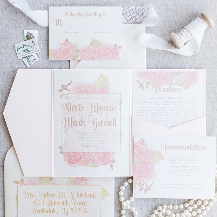 A suite featuring painted lush blooms in a soft watercolor style for a sweet blend of romantic and modern. | Wedding Invitations by CharmCat | Photo by Shalese Danielle