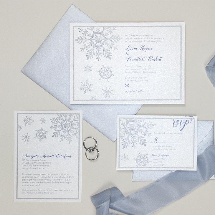The Watercolor Snowflake Wedding Invitation. Snowflake crystals painted in soft watercolor style decorate this invitation suite. The painted look gives the snowflakes the appearance of glass. Completely customize with your choice of colors, fonts, and papers. | Wedding Invitations by CharmCat | charmcat.net | CharmCat is a watercolor artist specializing in creating uniquely artistic stationery for weddings, birthdays, parties, offices, and everyday.